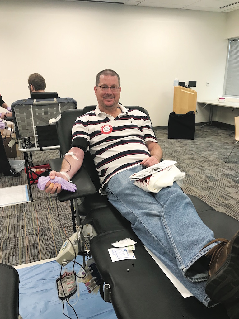 USAA employee giving blood